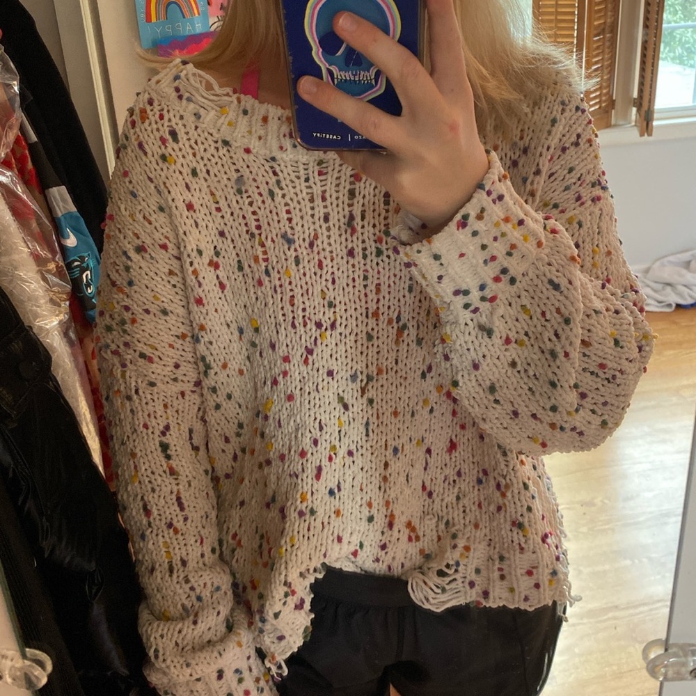 soft white distressed sweater with rainbow fluffs
